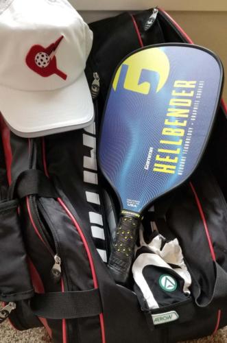 Gamma Hellbender Pickleball paddle with red PickleballPro hat